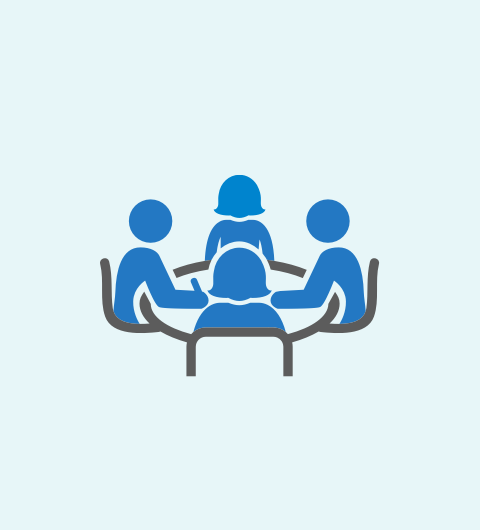 Icon showing people around a table in a workshop